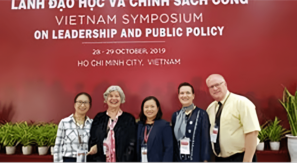Five participants pose for a photo at the Vietnam Symposium on Leadership and Public Policy, held in Ho Chi Minh City, October 28-29, 2019.